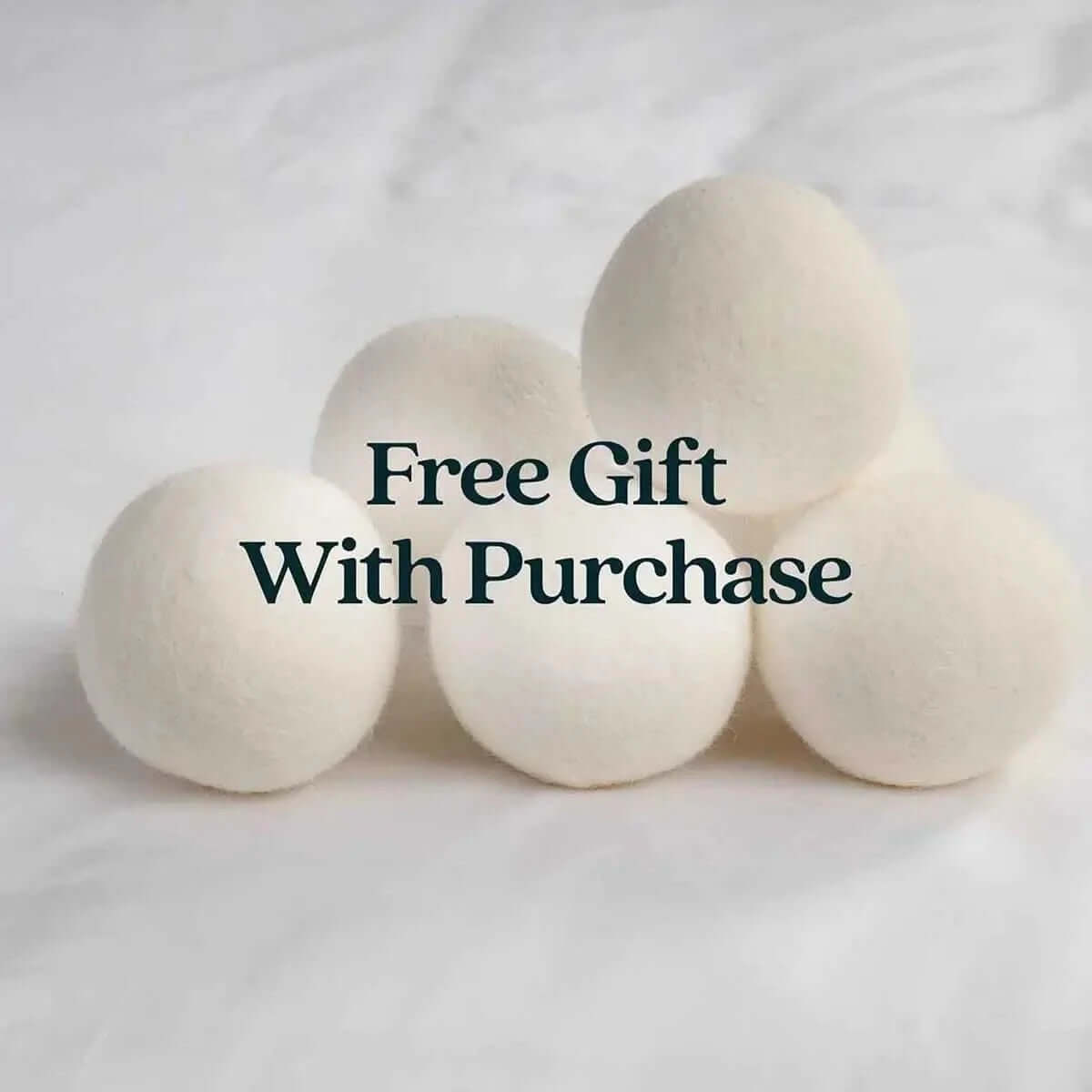 White bedding bundle — regenerative wool duvet and organic cotton sheets for night sweat relief.