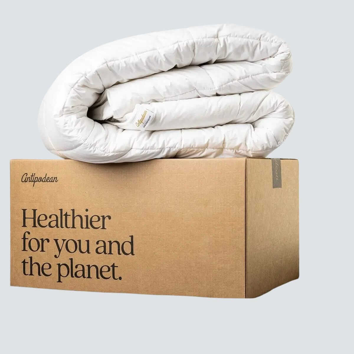 Organic regenerative bedding — comforter and sheet bundle crafted in New Zealand for sustainable living.